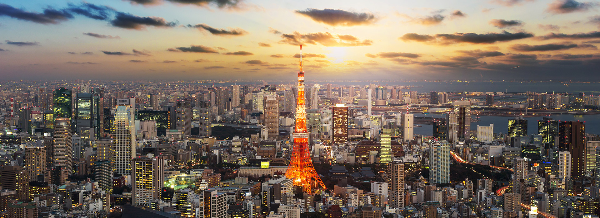 Tokyo skyline at sunset with Tokyo Tower.